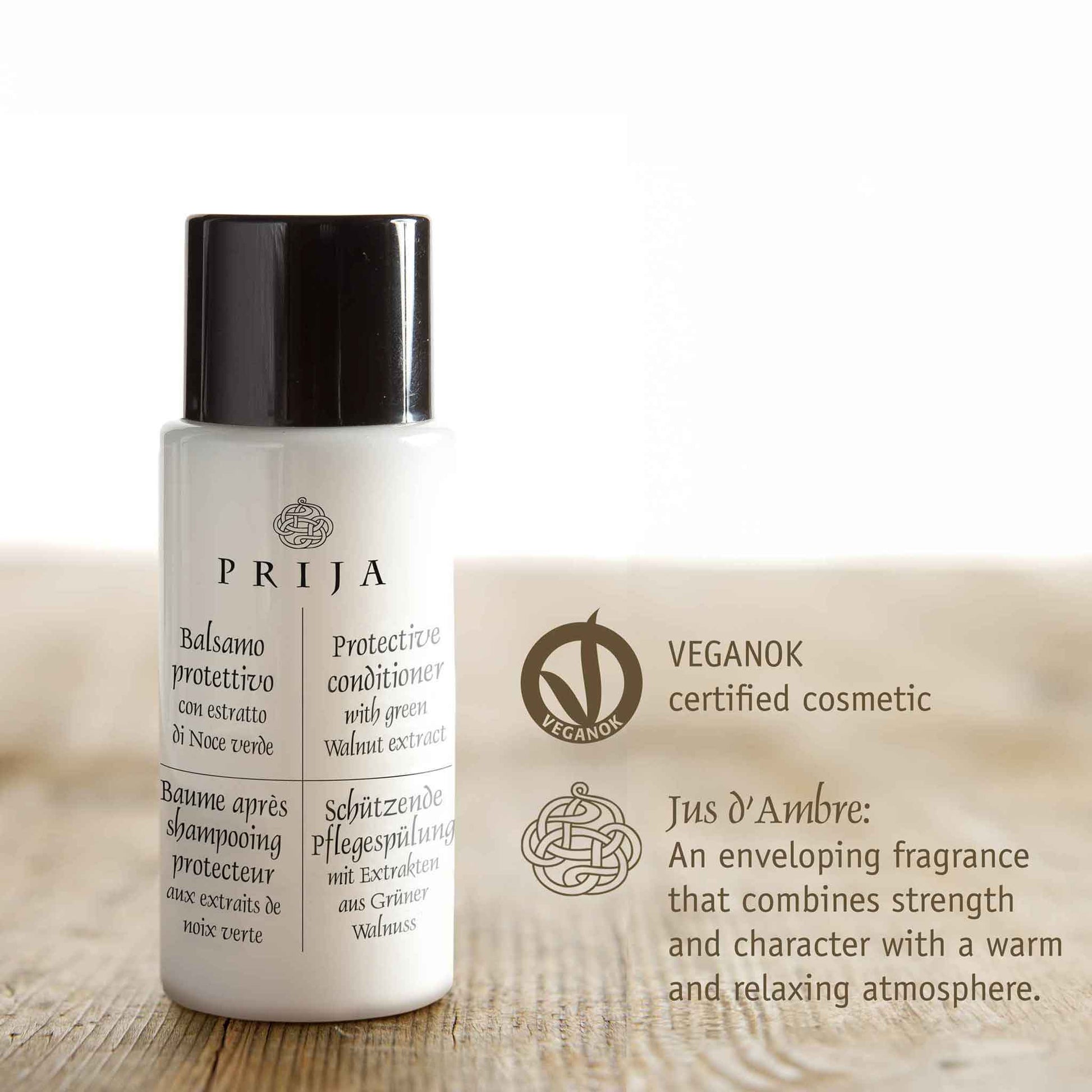 Prija conditioner bottle with branding and product description on a light background