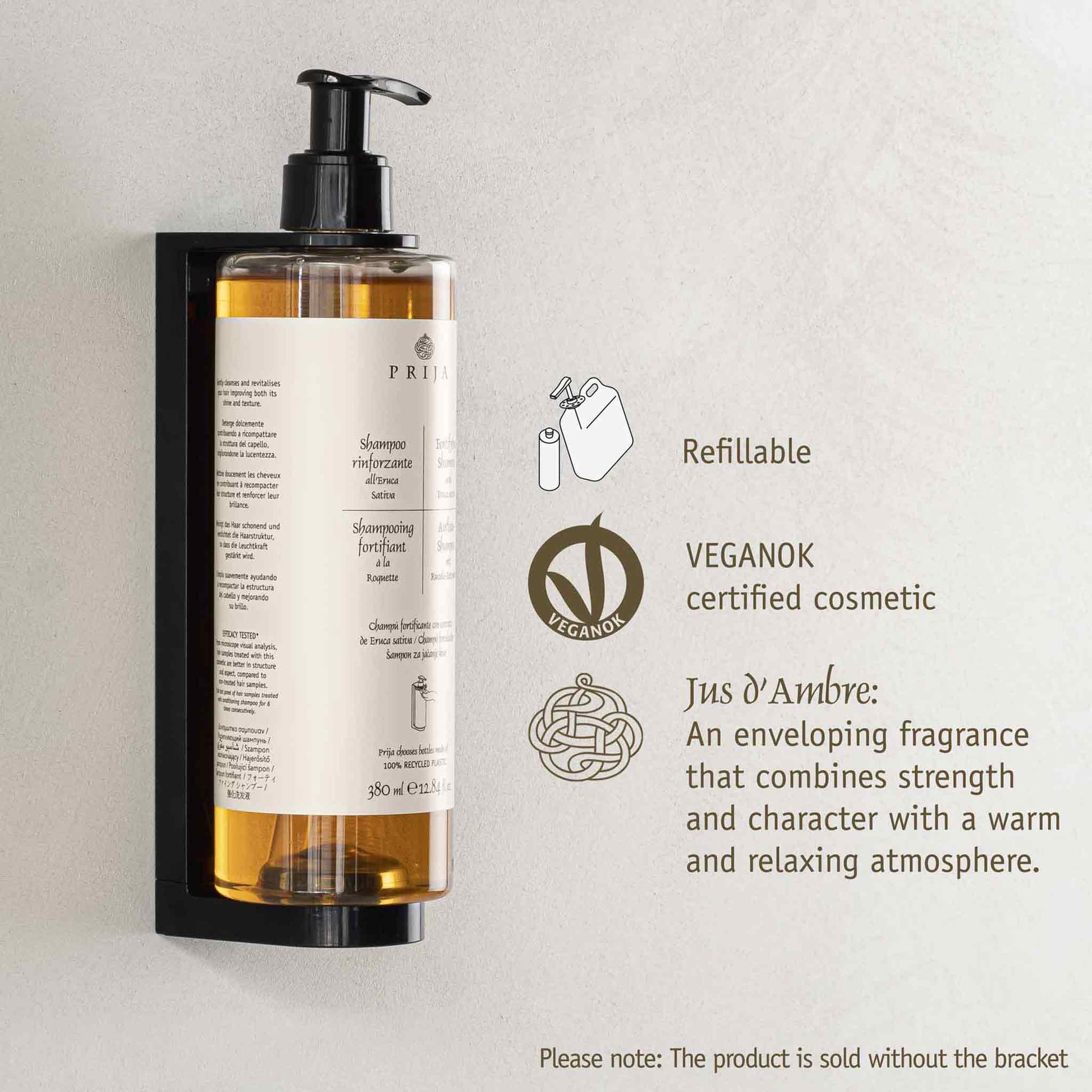 Shampoo bottle with pump on a light gray background, featuring refillable and vegan certification logos.