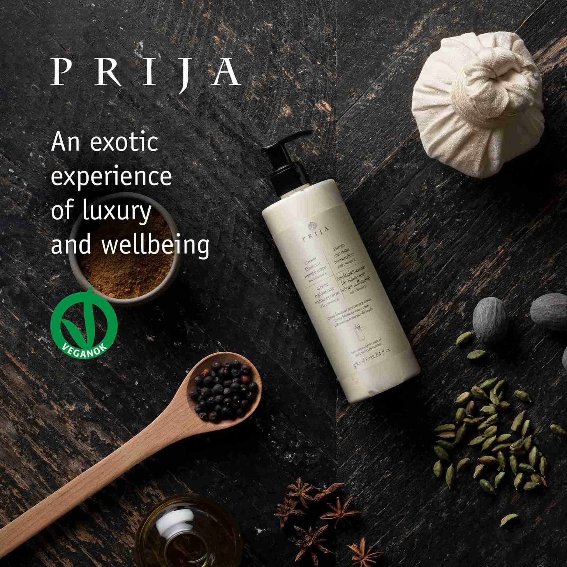 PRIJA product on a dark surface with spices and text about luxury and wellbeing.