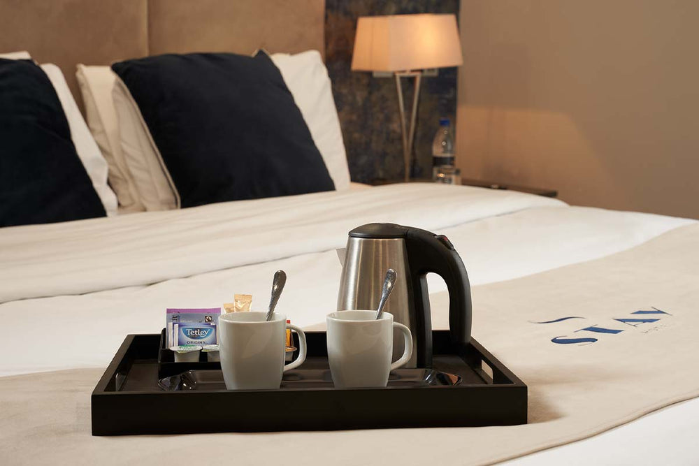 Hotel bedroom collection featuring a butler tray and kettle