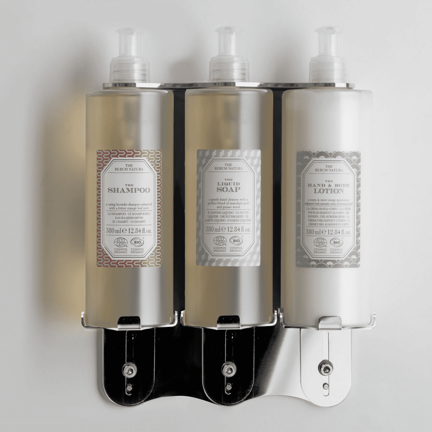 Triple pump dispenser bracket in stainless steel with Rerum Natura soap bottles