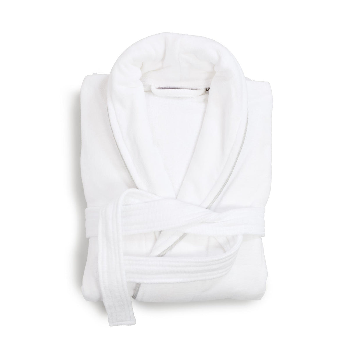 A folded white velour bathrobe with grey piping, a shawl collar and belt, photographed on a clean white background.
